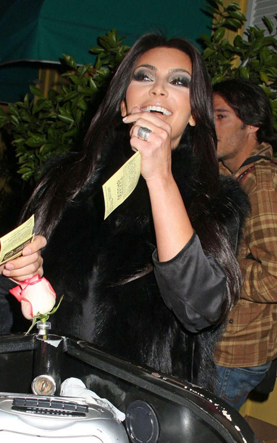 16P Kim Kardashian topless and all in black and high boots