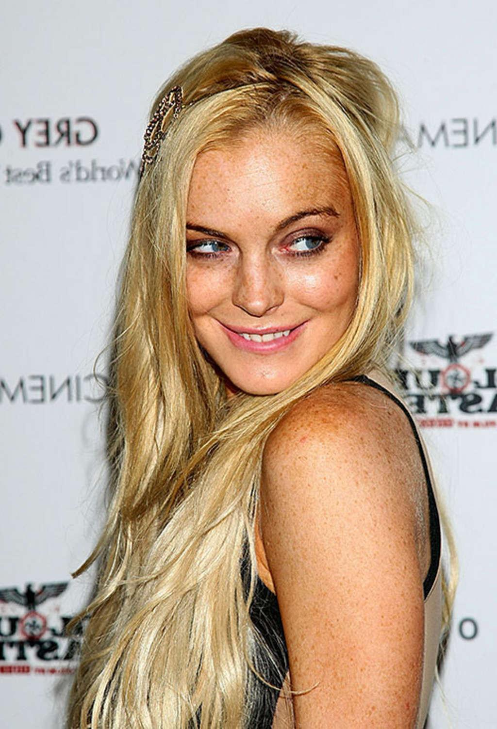 10P Lindsay Lohan exposing her great legs in mini skirt and posing topless for priva