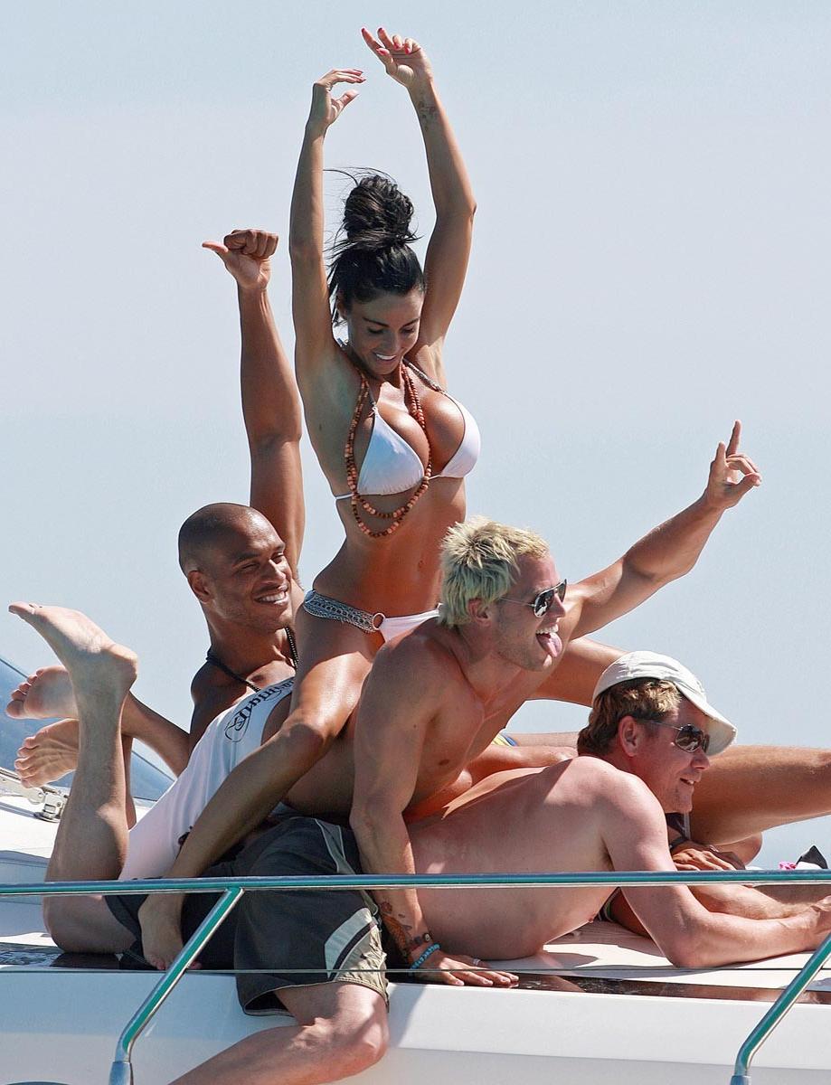 15P Katie Price flashing boobs and tanning topless
