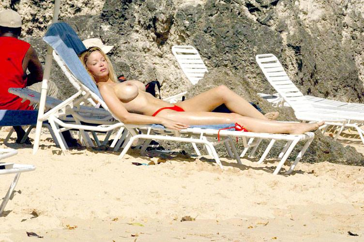 16P Alicia Douvall showing big tits on beach topless paparazzi pics