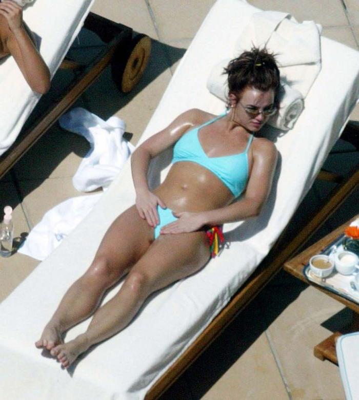 16P Britney Spears posing in topless and beach paparazzi pictures