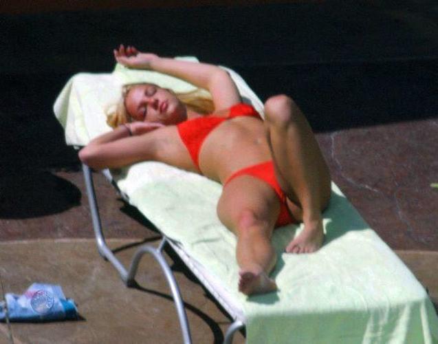 16P Britney Spears posing in topless and beach paparazzi pictures