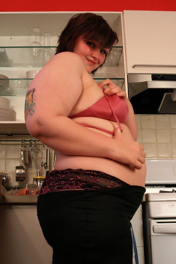 15P Big chubby babe fucks herself with a cucumber in the kitchen