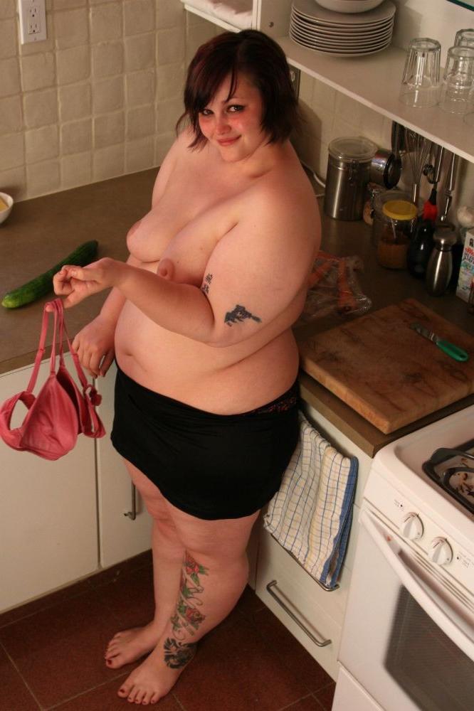 15P Big chubby babe fucks herself with a cucumber in the kitchen