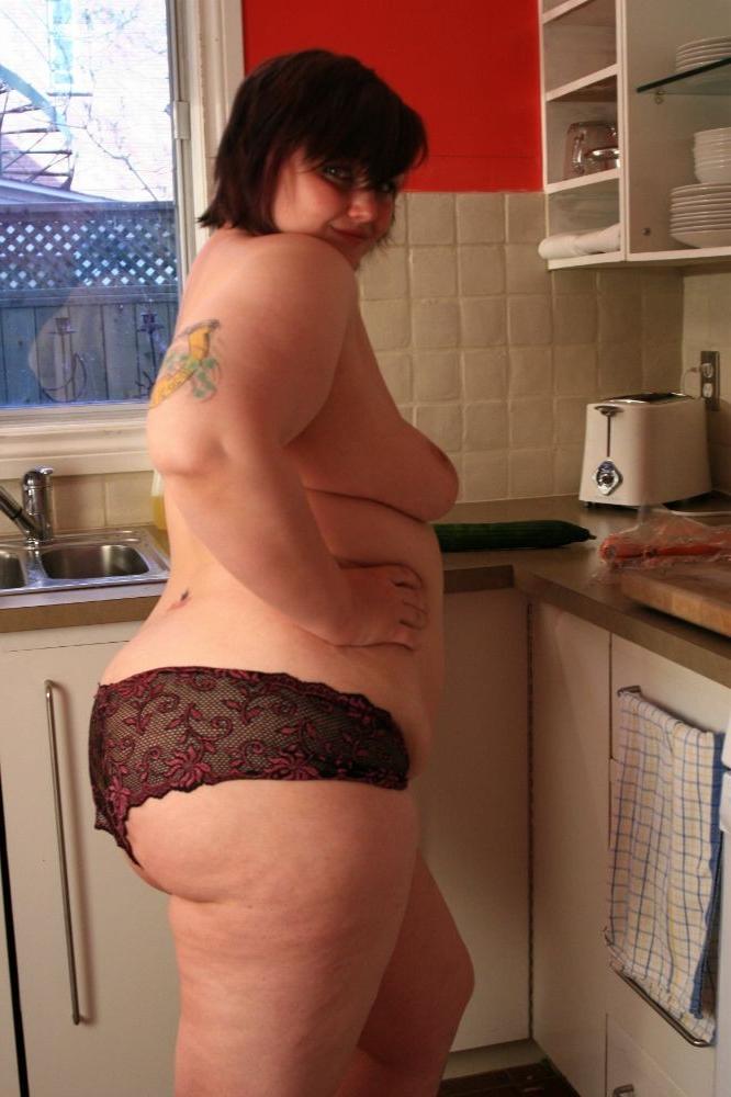 15P Big chubby babe fucks herself with a cucumber in the kitchen
