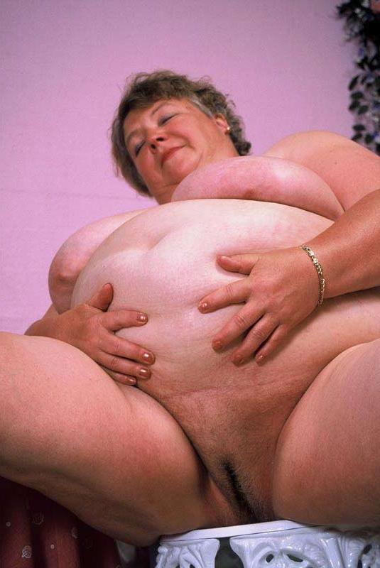 15P Bbw chubby granny showing her huge stomach and big tits