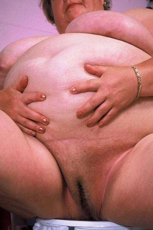 15P Bbw chubby granny showing her huge stomach and big tits