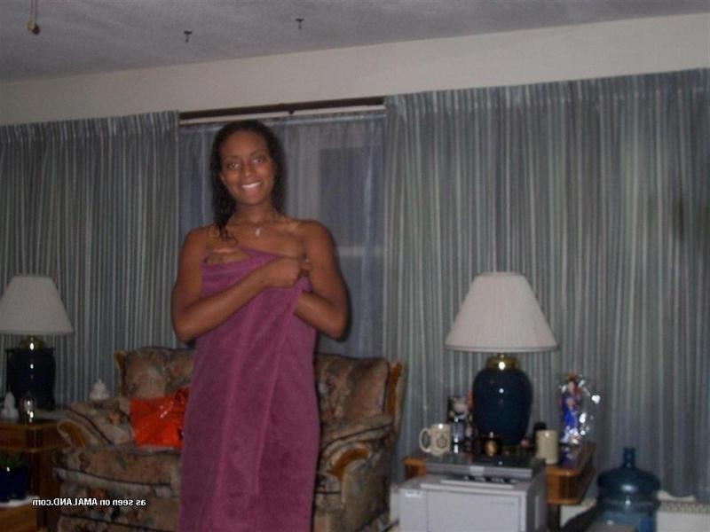 15P Ebony coed strips and fingers her cunt in photo collection
