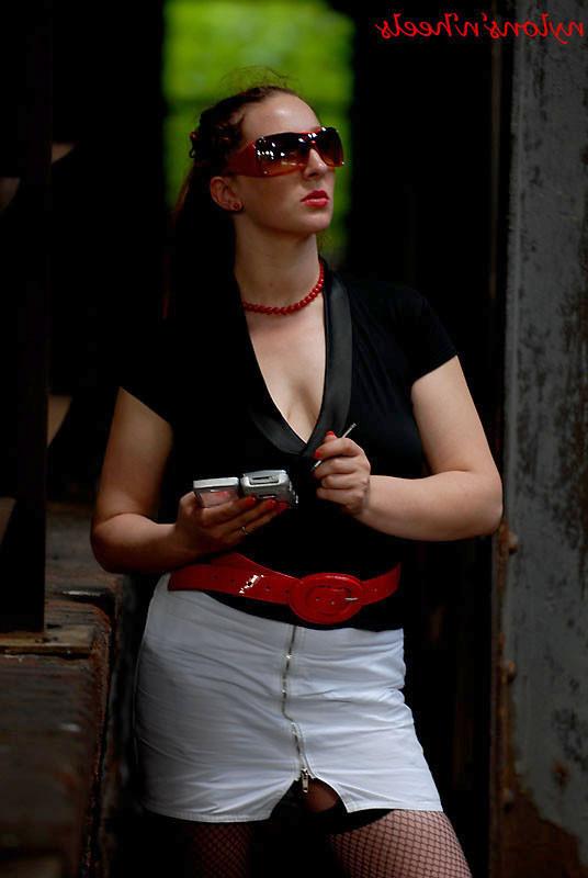 12P Redhead Justine posing in public
