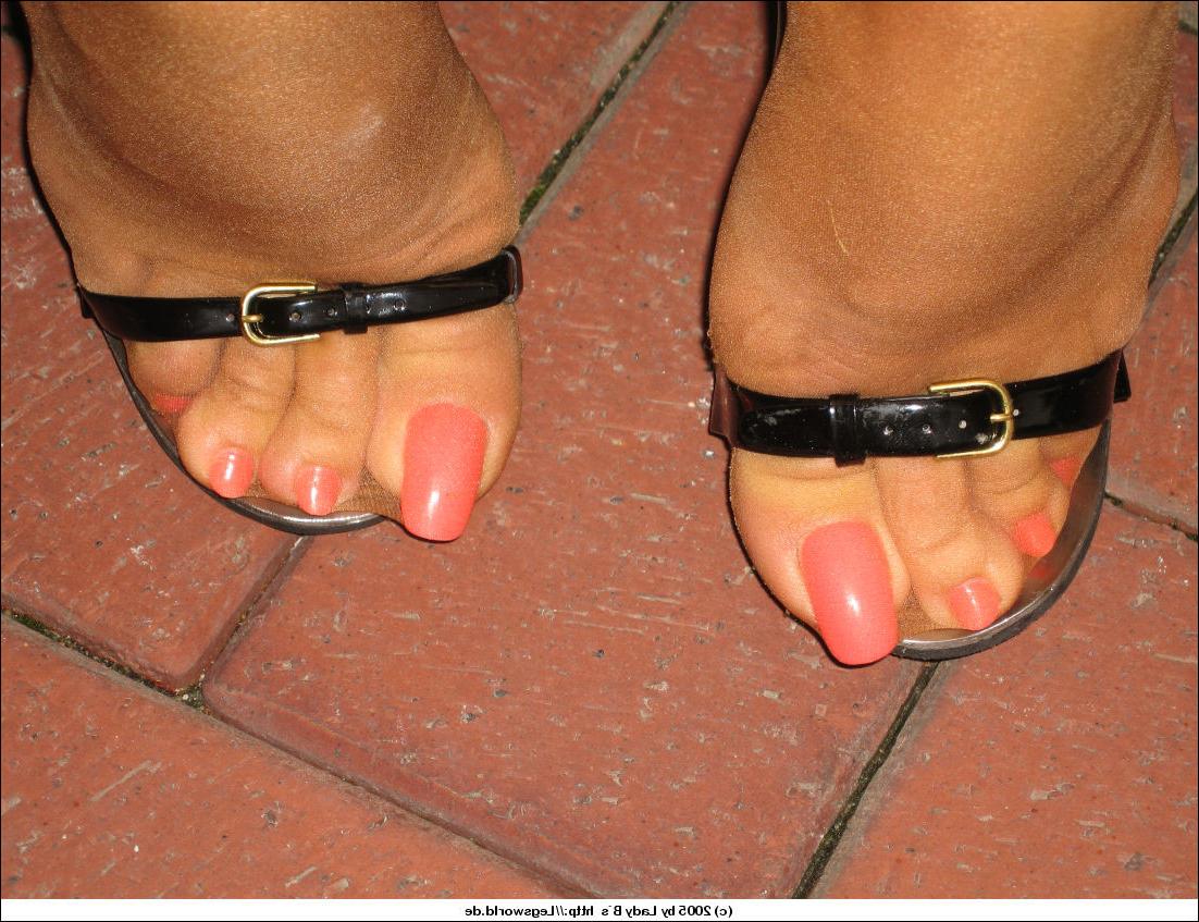 12P Elegant milf displaying her stocking legs and feet