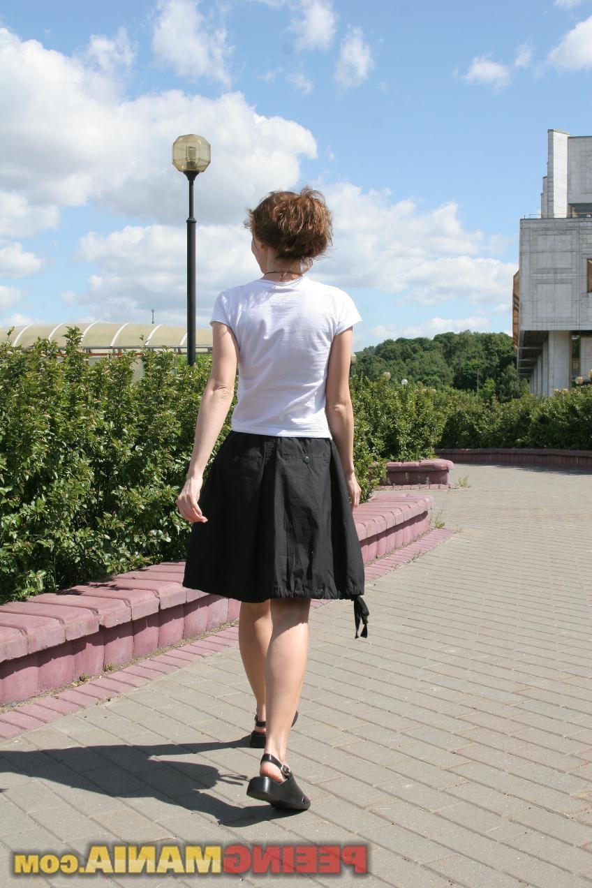 15P Happy blondie in black and white pees thru the black panties in public