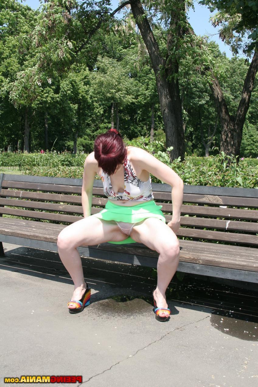 11P Total bitch spreads her legs wide and pees thru panties on the bench