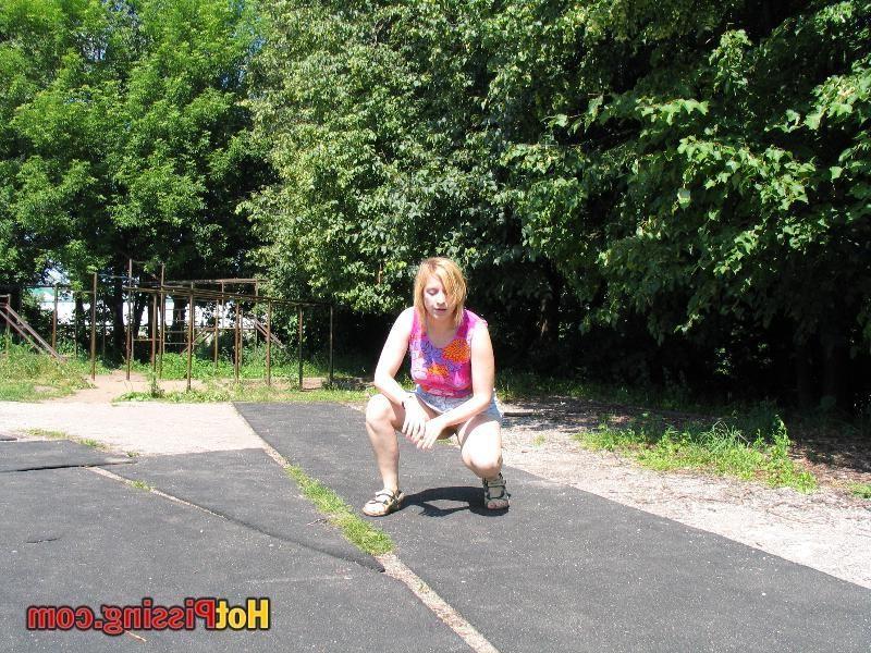 10P Voluptuous blonde bitch strikes a squatted pose and whizzes in public