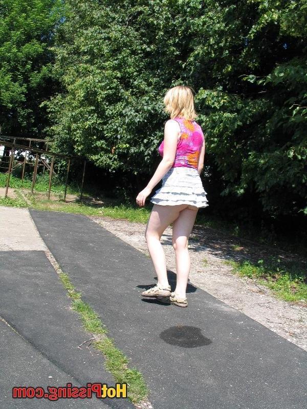 10P Voluptuous blonde bitch strikes a squatted pose and whizzes in public