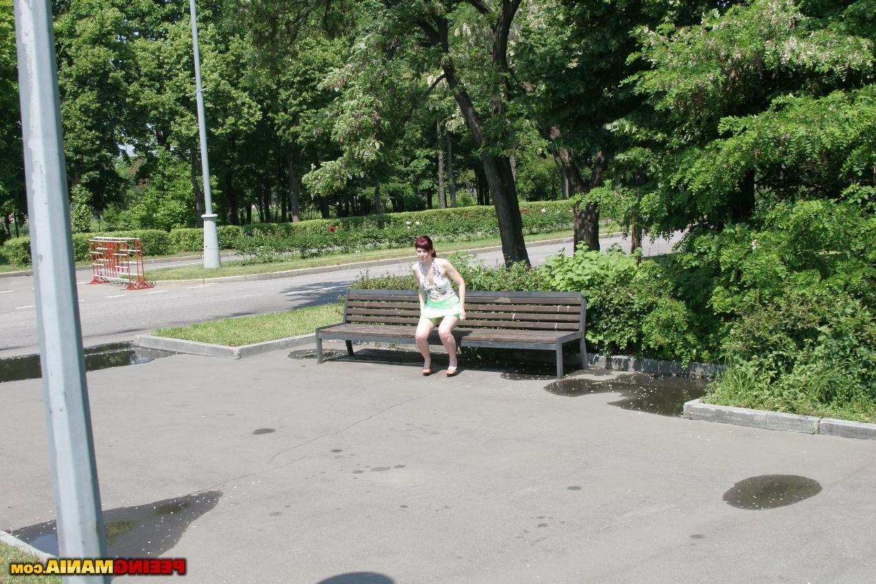 15P Redhead bitch spreads her legs and pees right in the panties outdoors