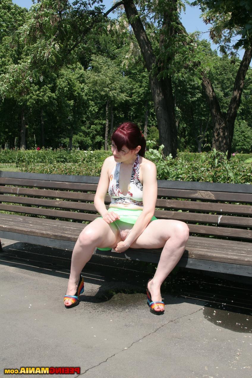 15P Redhead bitch spreads her legs and pees right in the panties outdoors