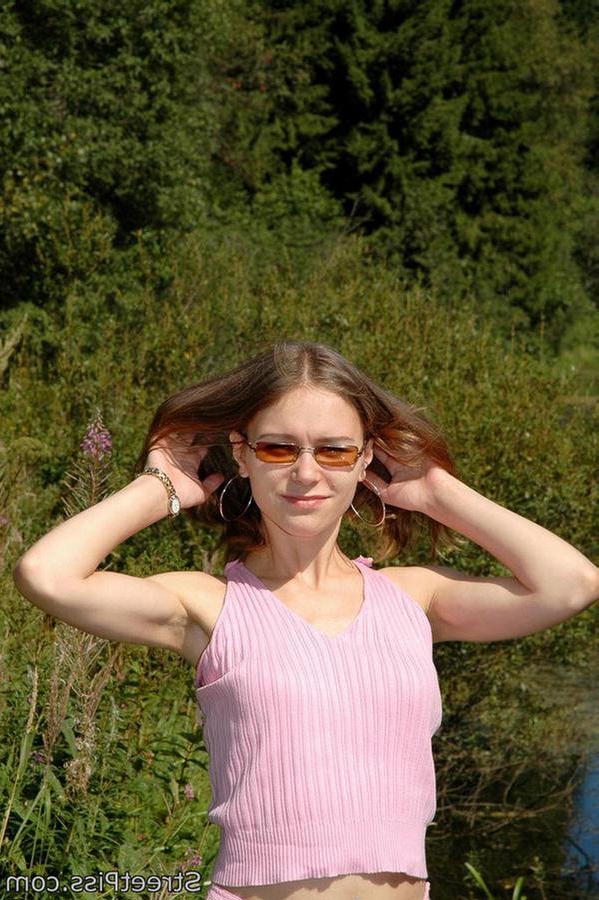 12P Leggy young hottie parades pee play on a bank