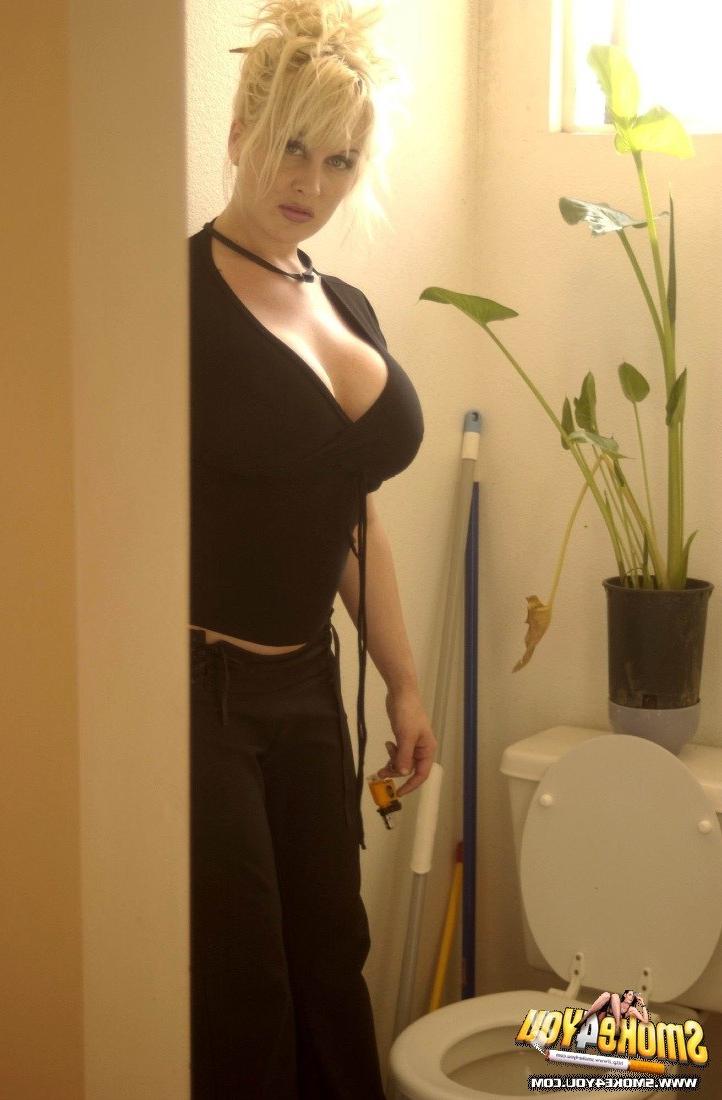 16P Huge Breasted White trash smokes like crazy on the toilet