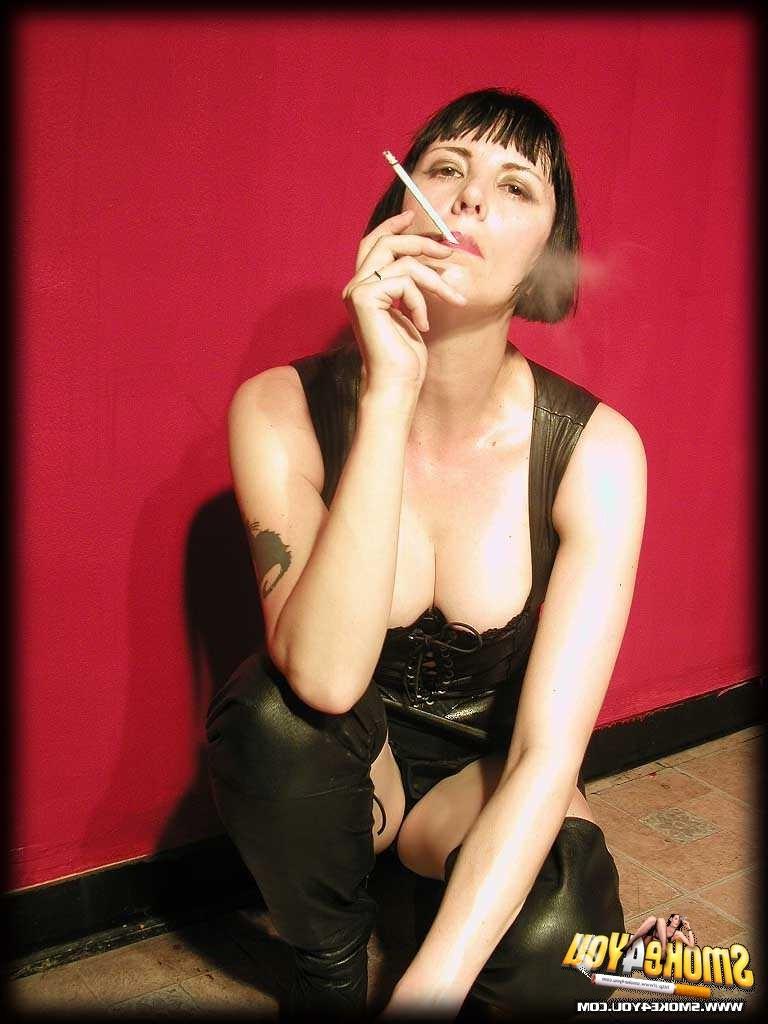 16P Katja models her leather gear while dragging cigarette