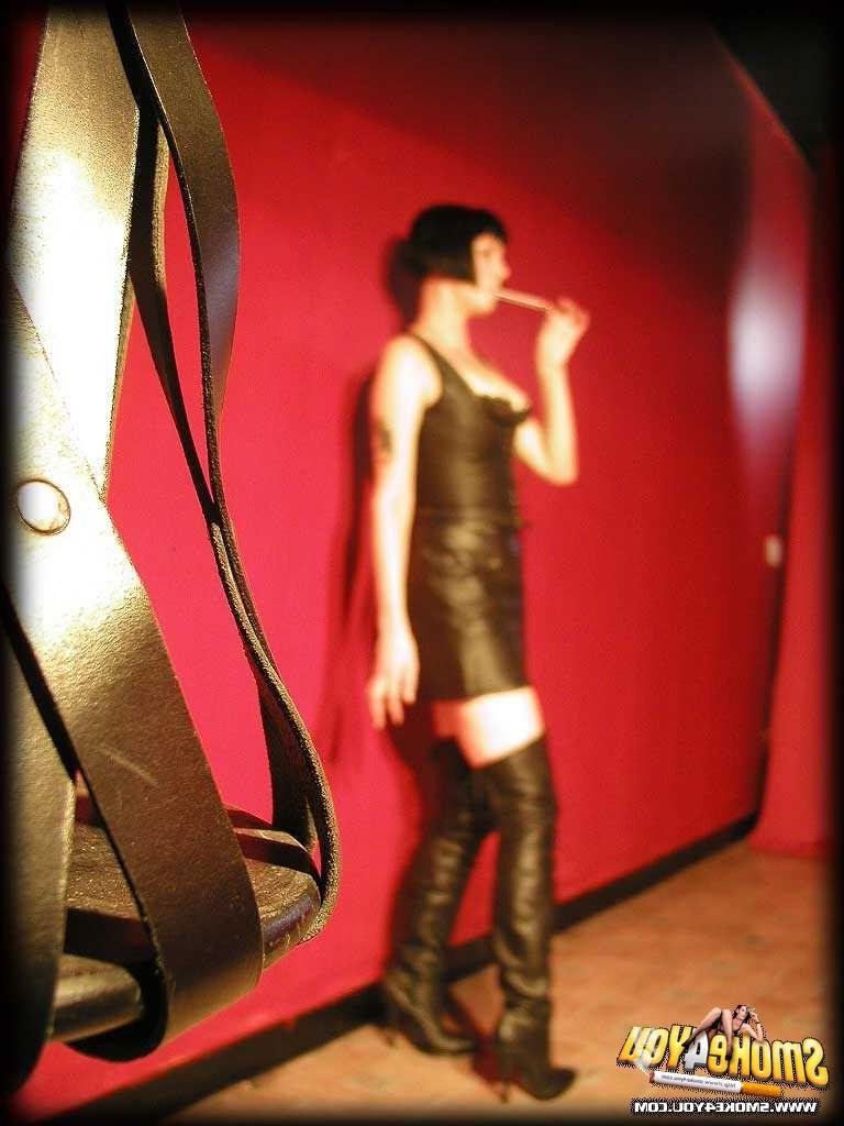 16P Katja models her leather gear while dragging cigarette