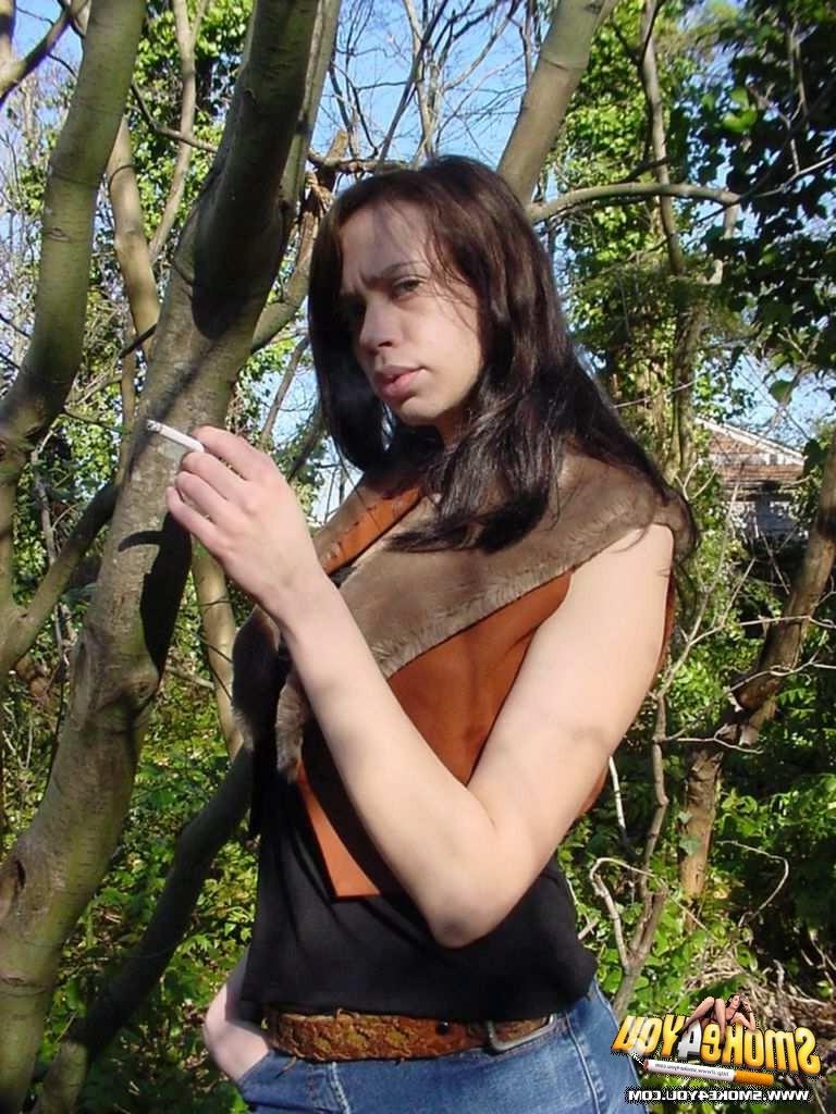 16P Sexy Anita walks through the forest puffing her cigarette