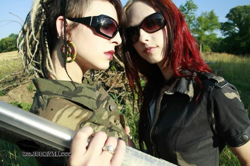 16P Two goth chicks play with guns and each other