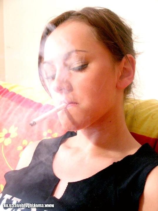 16P Vicky smokes a cigarette while showing her nice tits on the couch