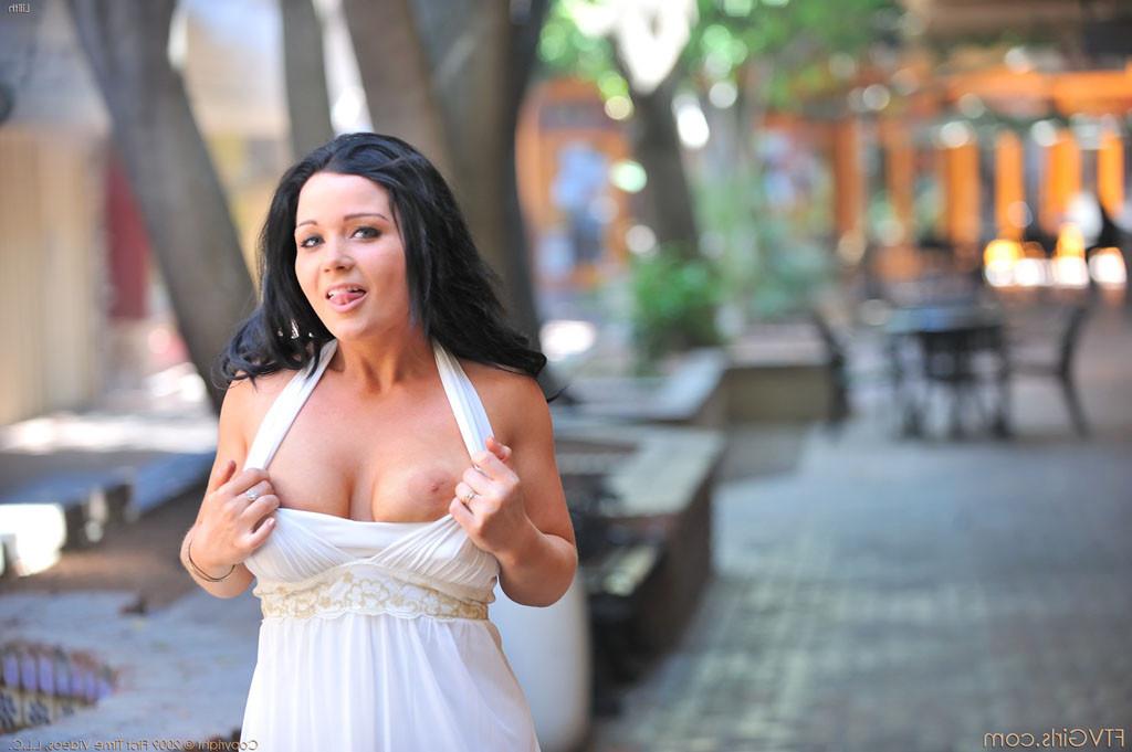 15P Lilith Eve flashes her breasts and spreads her legs in public