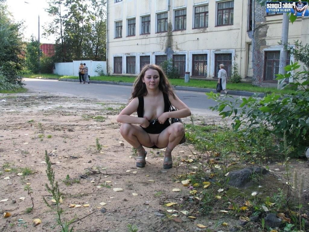 15P Bold babe squats to play with her bubs and display her cunt in public