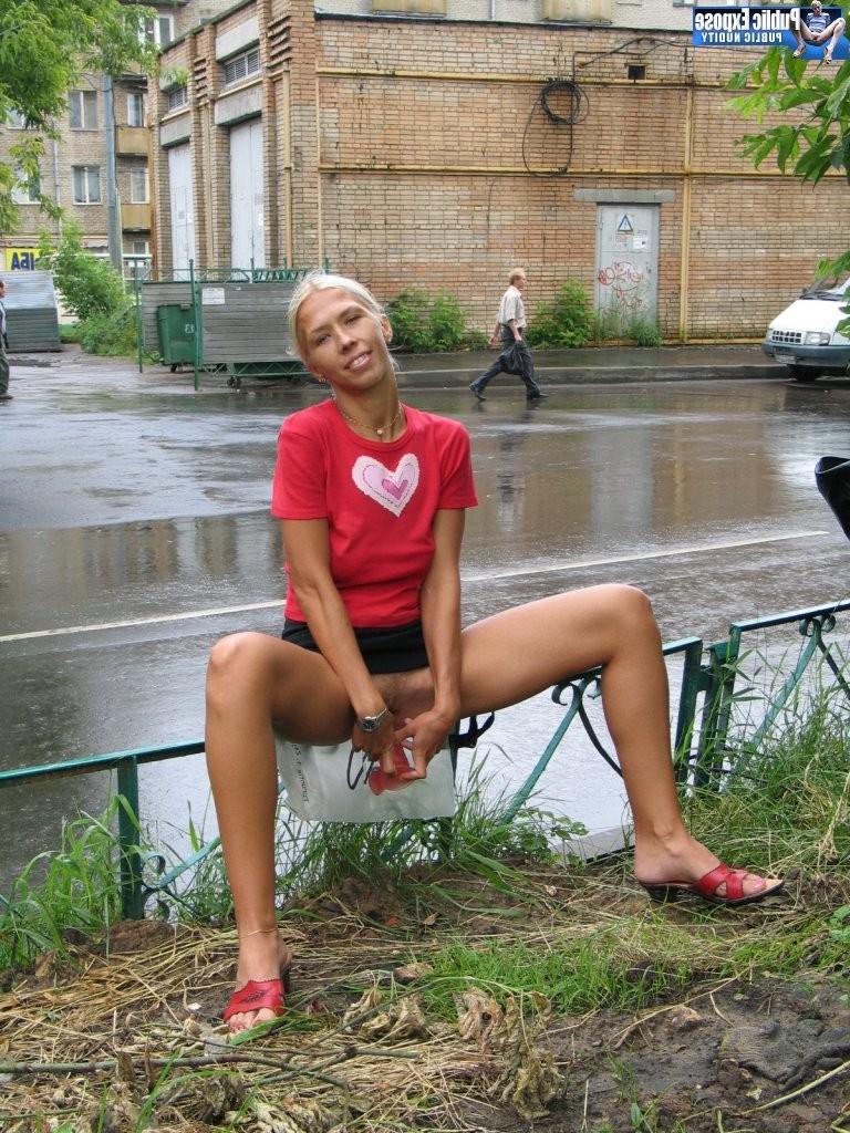 15P Excited blonde flasher plays with her boobs and snatches in public