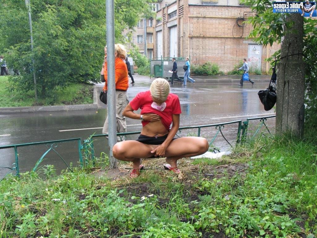 15P Excited blonde flasher plays with her boobs and snatches in public