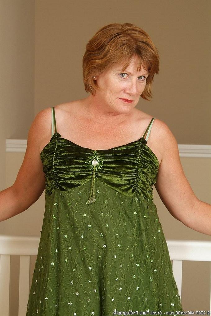 16P Mature redhead granny stripping and spreading her vagina