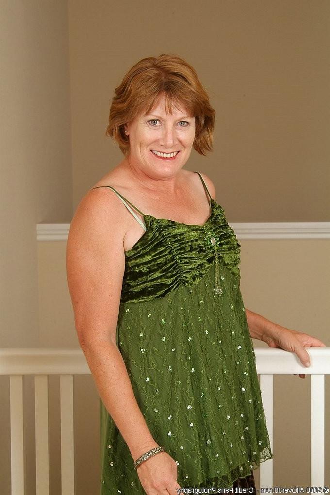 16P Mature redhead granny stripping and spreading her vagina
