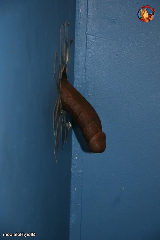 15P Gianna Michaels sucks a big black cock through a gloryhole
