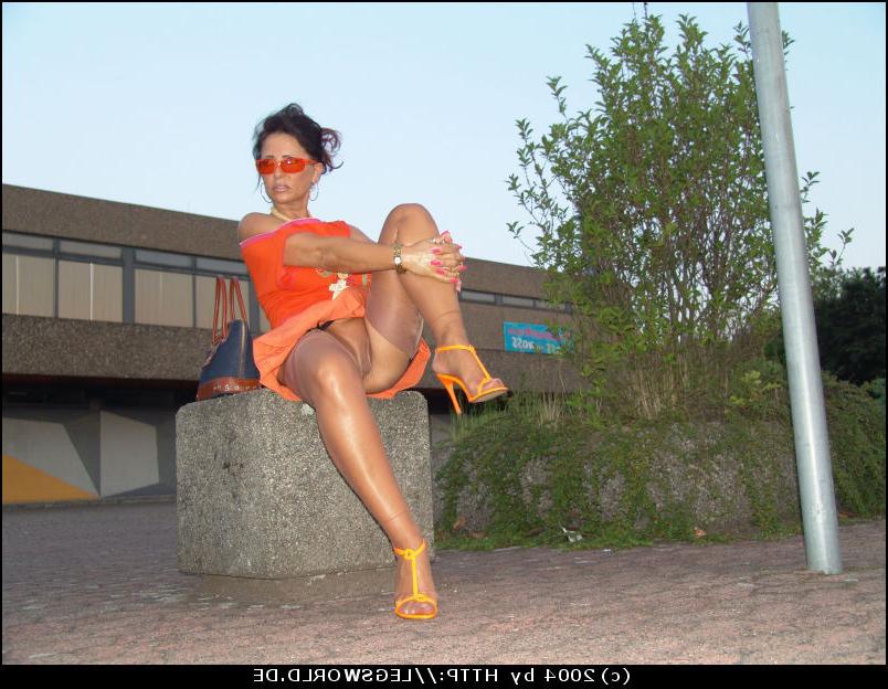 12P Leggy german lady in tan stockings posing in public