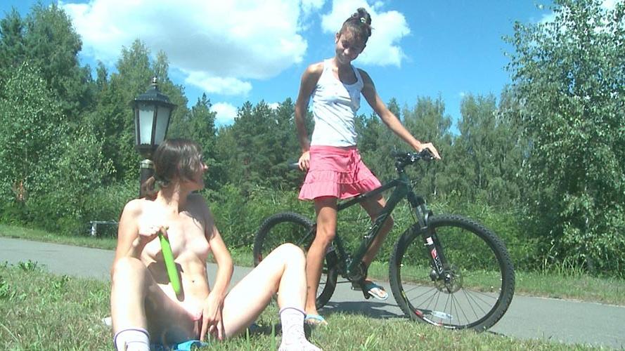 17P Two nasty teen babes playing with their favorite toys outdoors