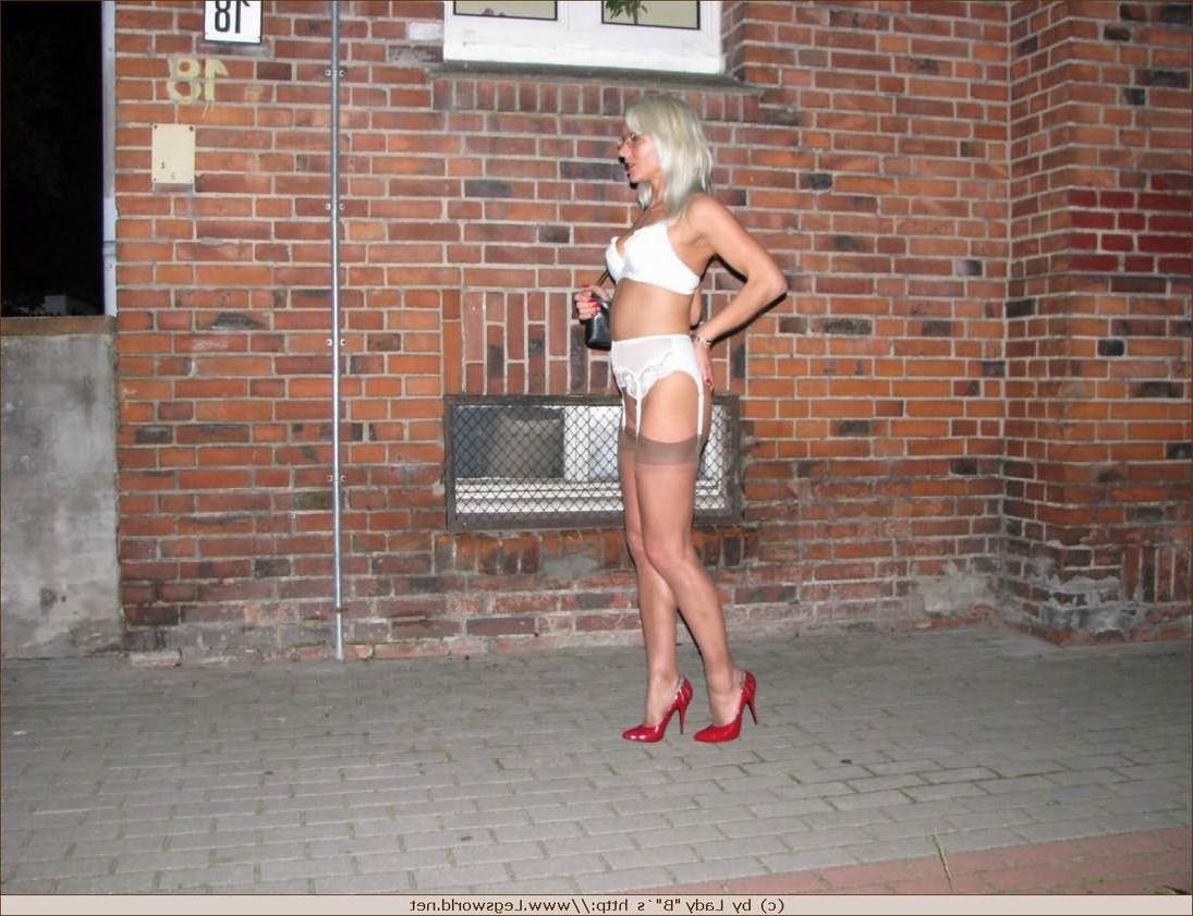 12P Amateur german babe in stockings posing in public