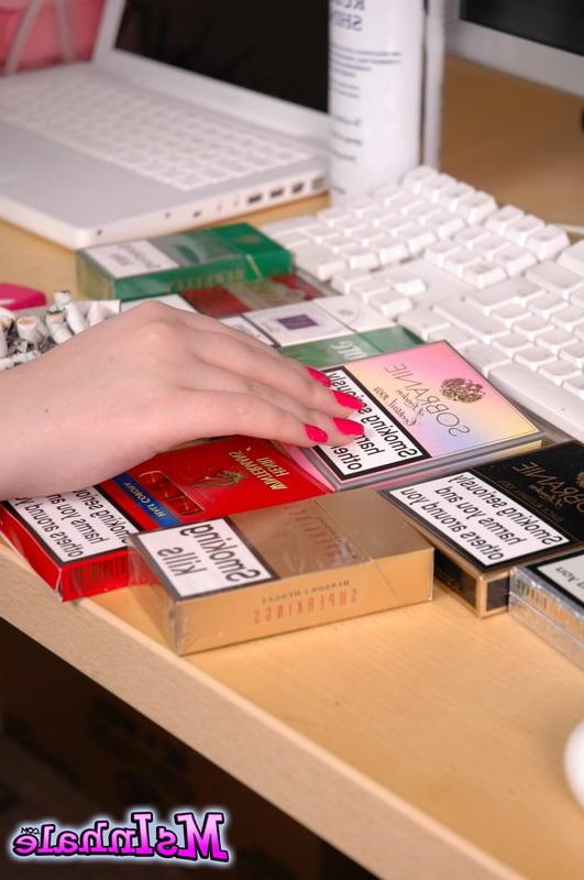16P brunette teen smoking a cigarette