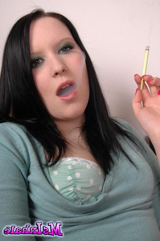 16P brunette teen smoking a cigarette