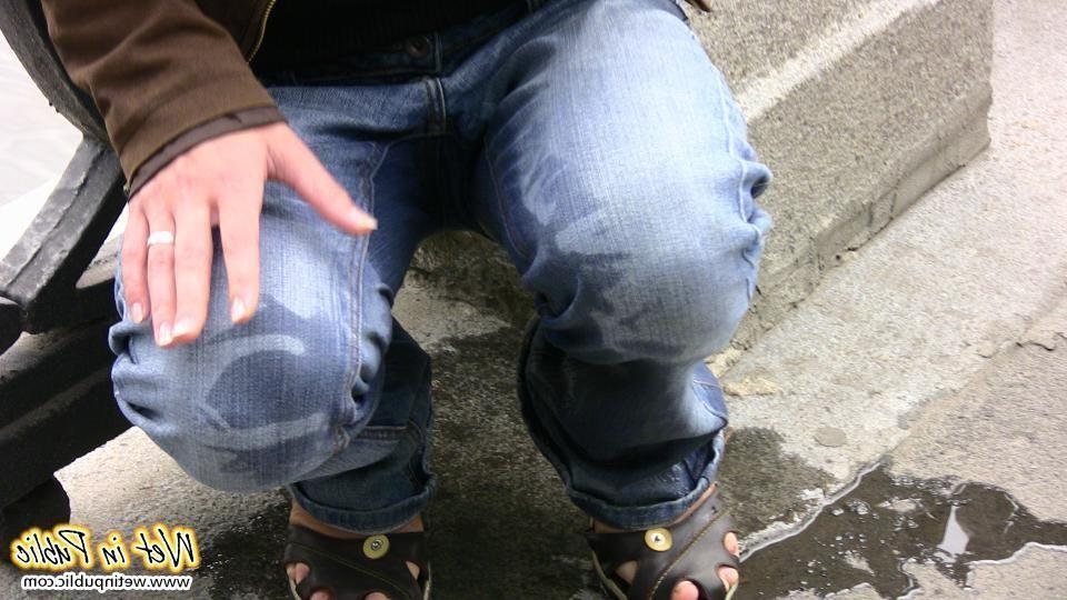 12P Nervous grin of a girl in glasses who pissed in her jeans in public