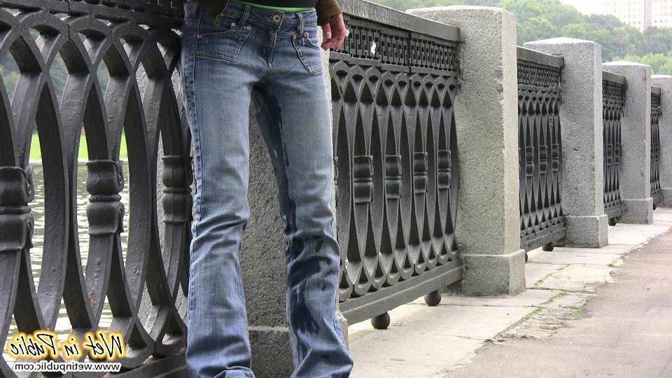 12P Nervous grin of a girl in glasses who pissed in her jeans in public