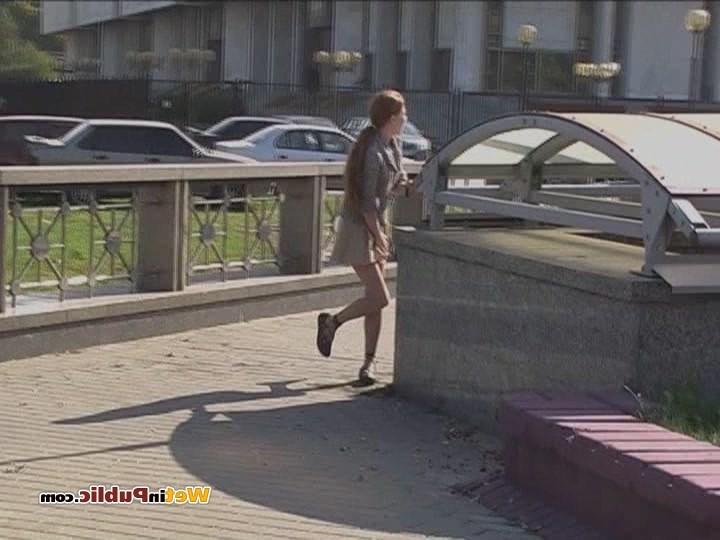 12P Disconcerted cutie splashes her skirt and legs with pee in the street