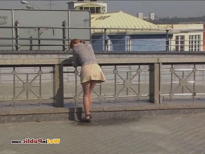 12P Disconcerted cutie splashes her skirt and legs with pee in the street