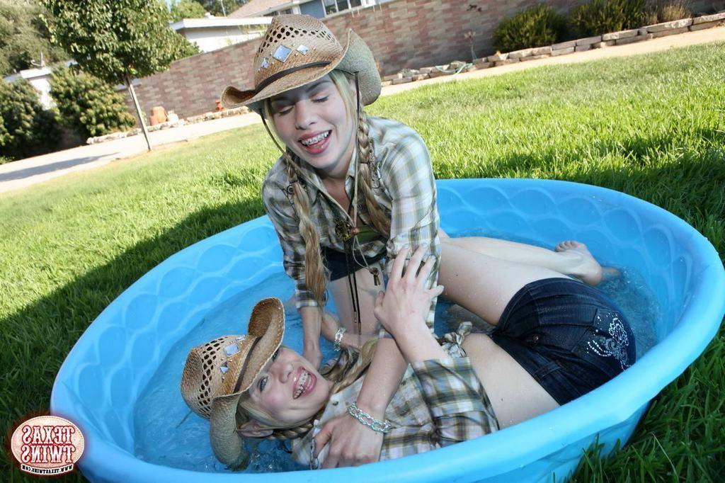 14P Tiny titted eighteen year old twins play in the swimming pool