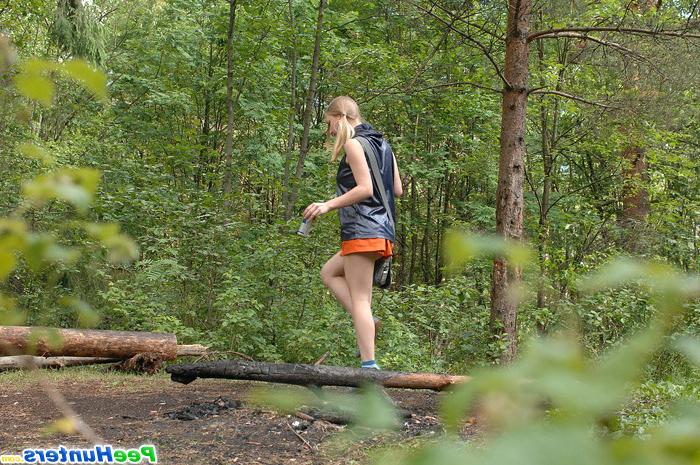 16P Girl stops to smoke a cig and take a leak in woods