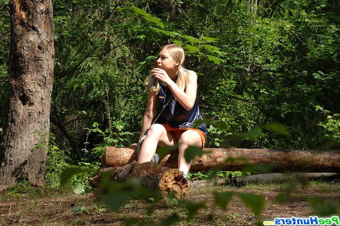 16P Girl stops to smoke a cig and take a leak in woods
