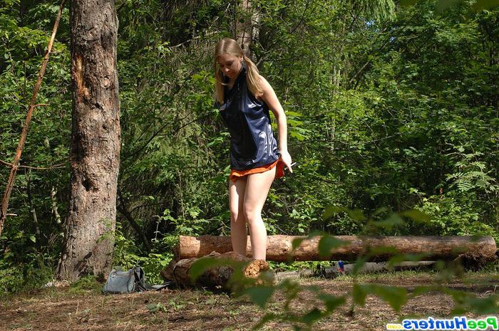 16P Girl stops to smoke a cig and take a leak in woods