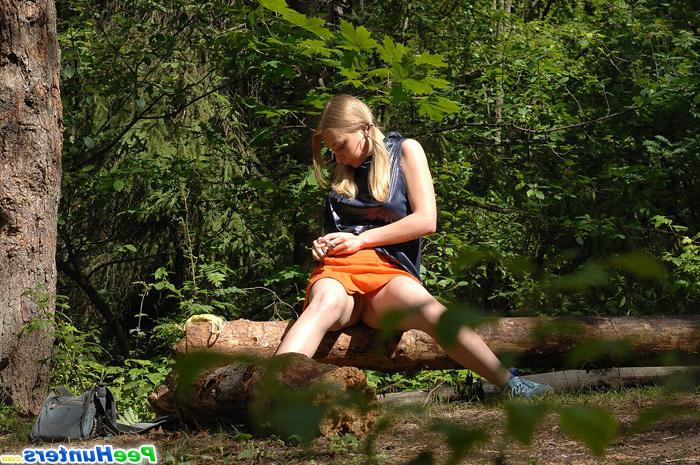 16P Girl stops to smoke a cig and take a leak in woods