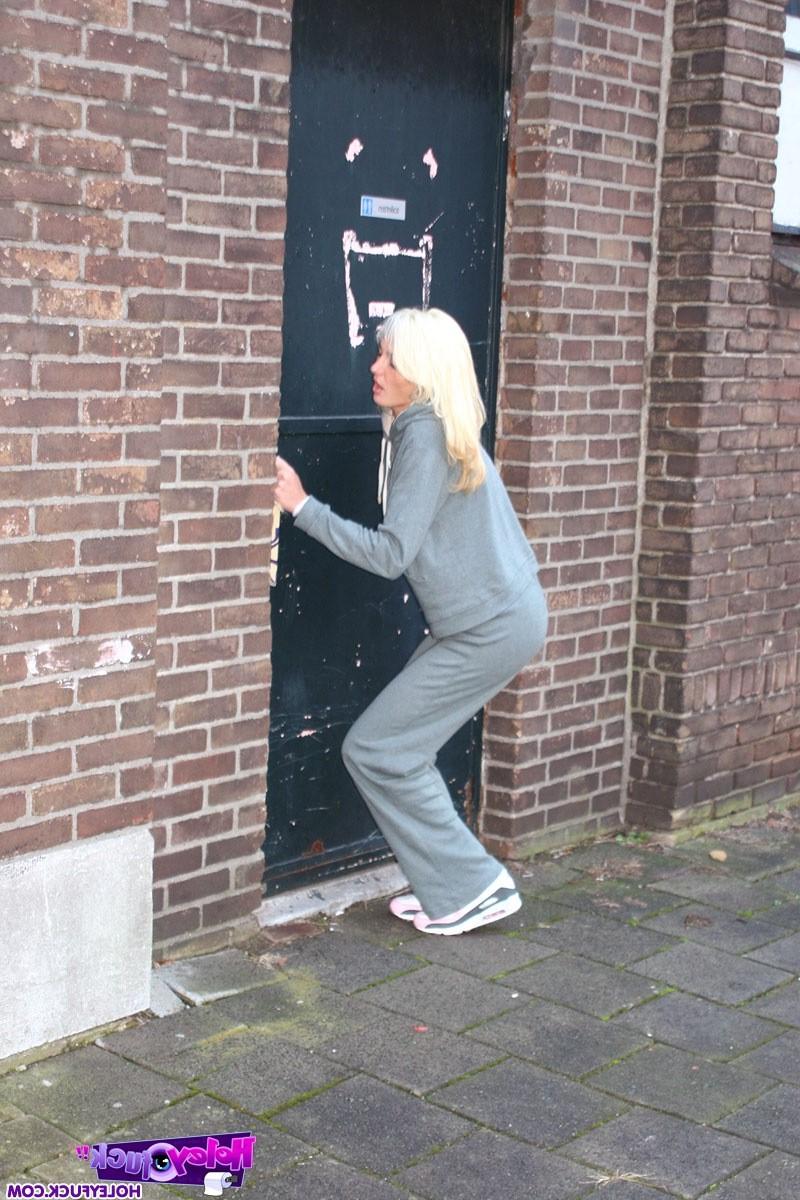 14P Blonde sucks an anonymous stiffy trough a gloryhole wall