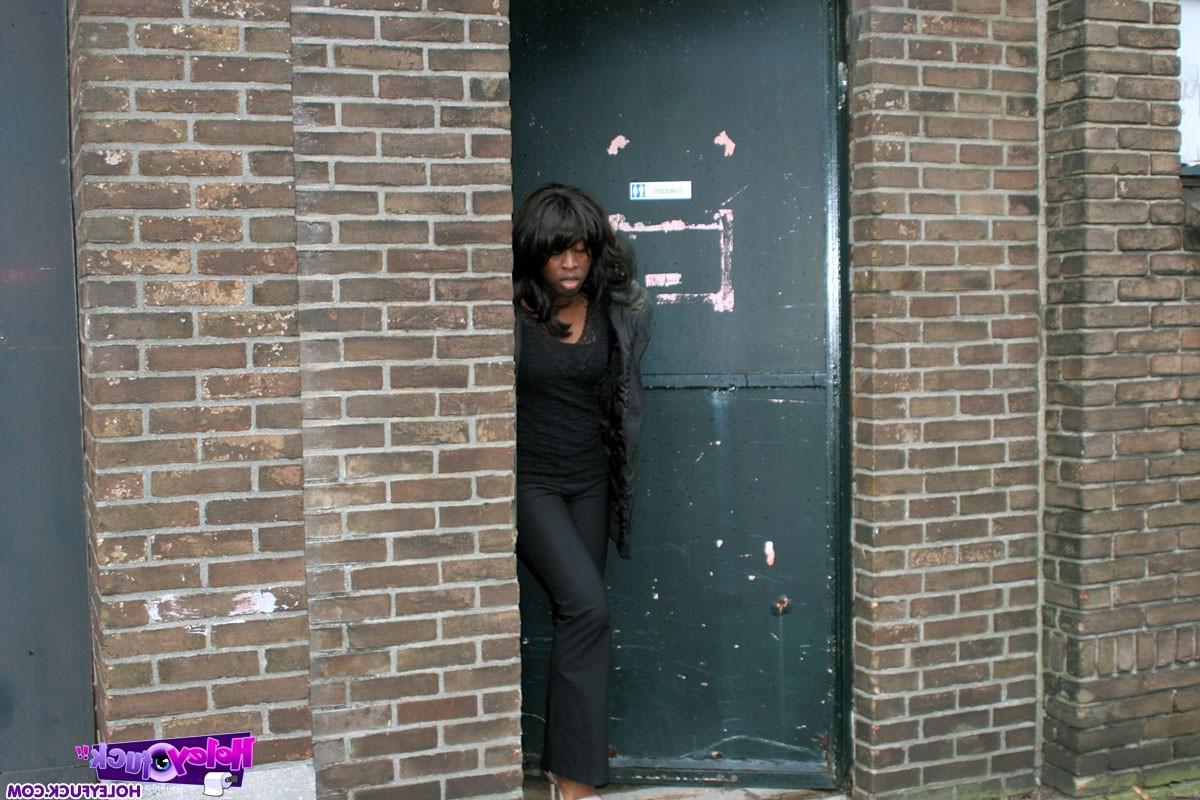 14P Ebony girl gets surprised with a cock trough a gloryhole